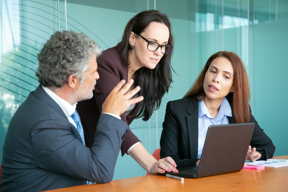 Directors reviewing board papers together